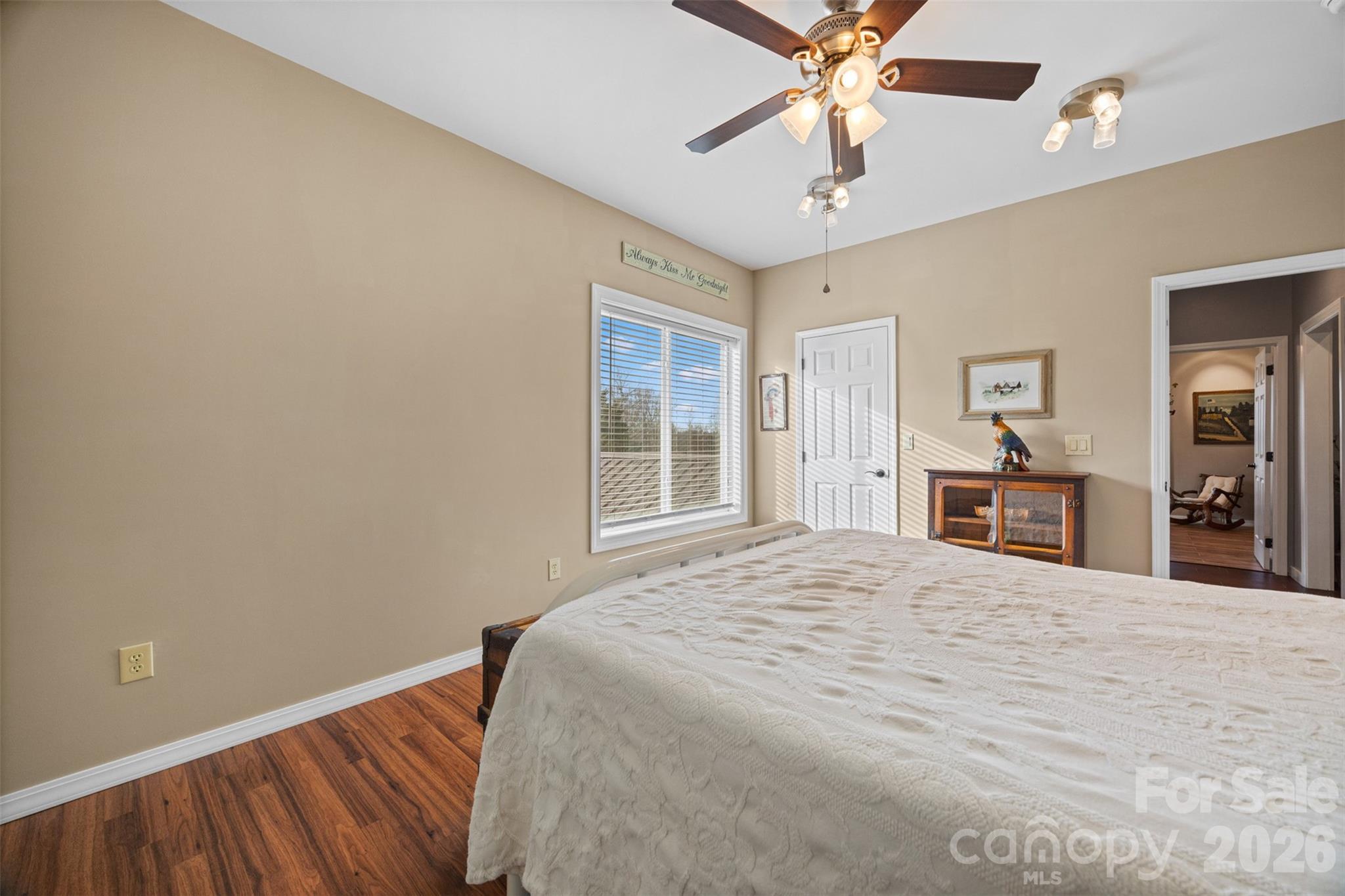 445 Warren Road Taylorsville, NC 28681 - Photo 35 of 48 a bedroom with a large bed and a chandelier