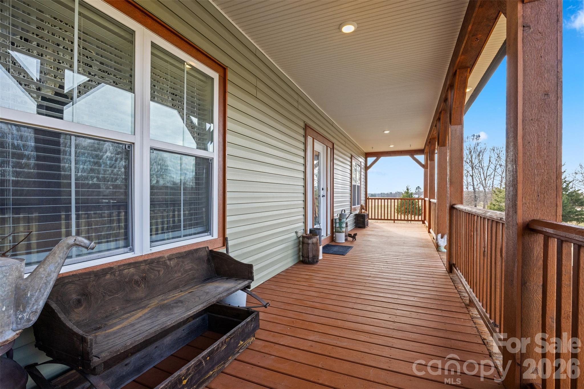445 Warren Road Taylorsville, NC 28681 - Photo 38 of 48 a balcony with wooden floor and furniture