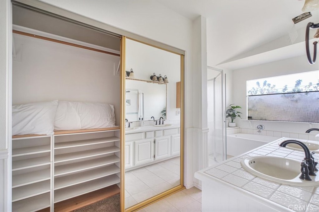 79040 Cliff Street Bermuda Dunes, CA 92203 - Photo 21 of 42 a bathroom with a sink and a mirror