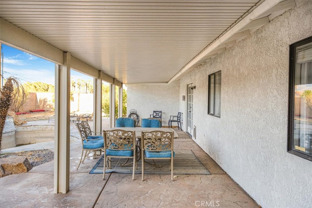 79040 Cliff Street Bermuda Dunes, CA 92203 - Photo 31 of 42 a dining room with furniture and window