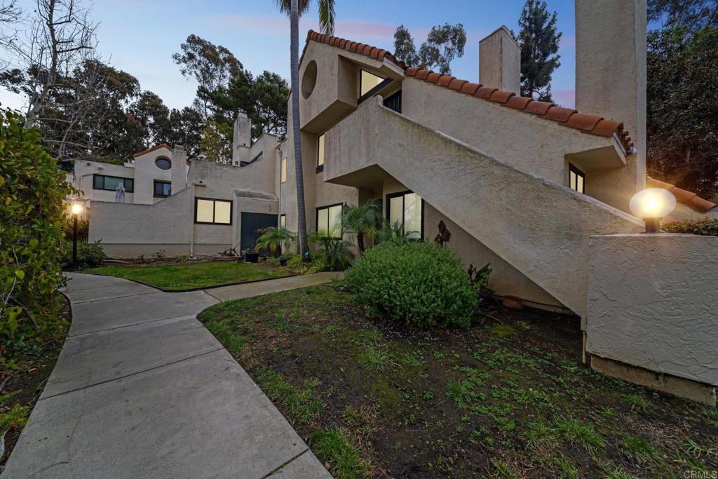 317 North Melrose Drive, Unit E Vista, CA 92083 - Photo 22 of 30 front view of a house with a yard