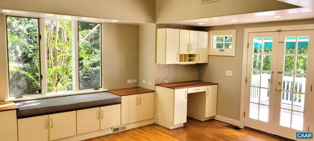 a view of a kitchen with a large window