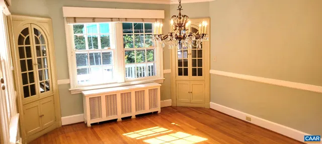 a view of a house with wooden floor and windows