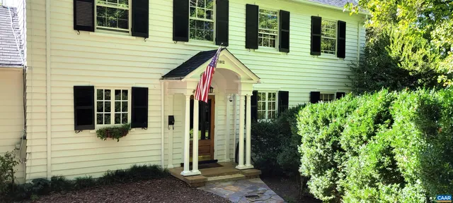 a view of a house with brick walls