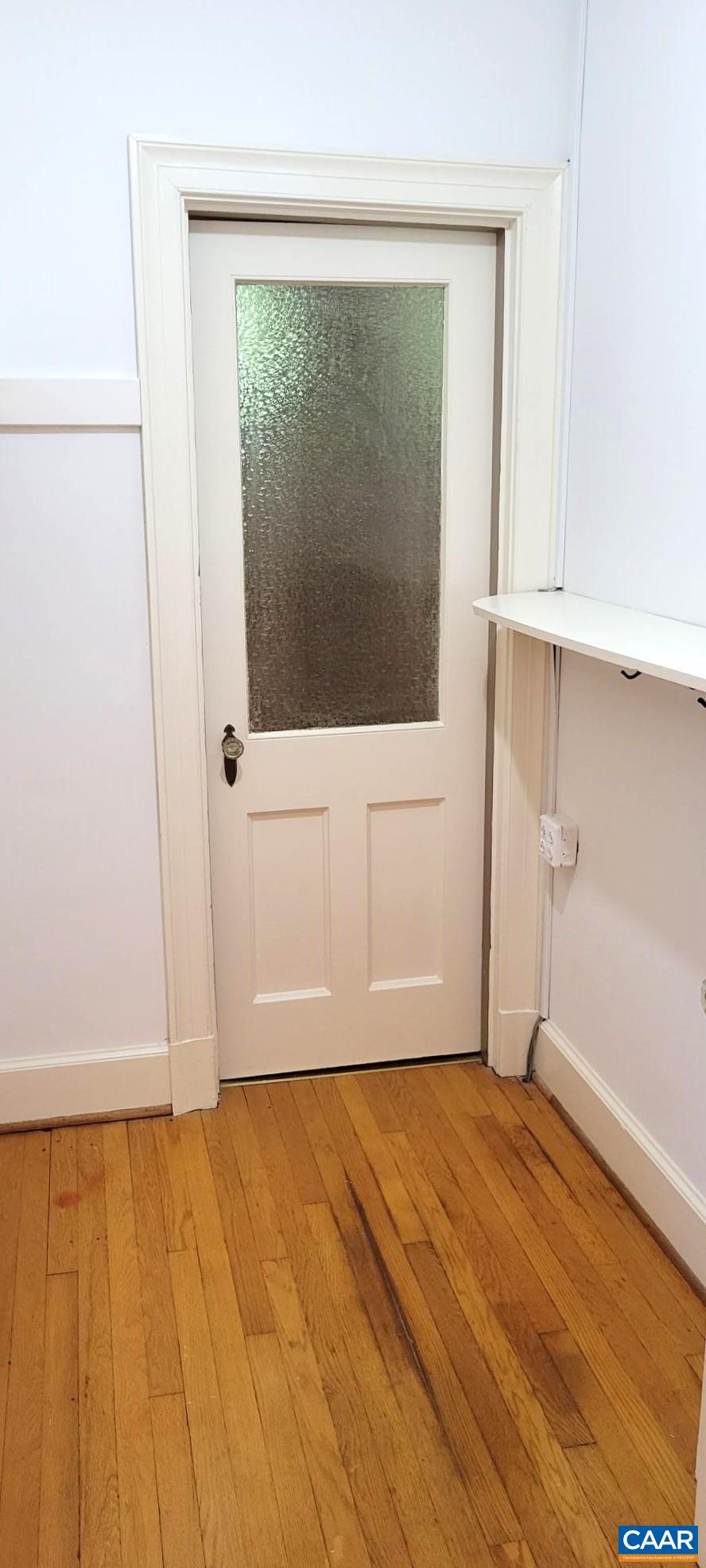 1912 Blue Ridge Road Charlottesville, VA 22903 - Photo 25 of 49 a view of empty room with wooden floor and fan