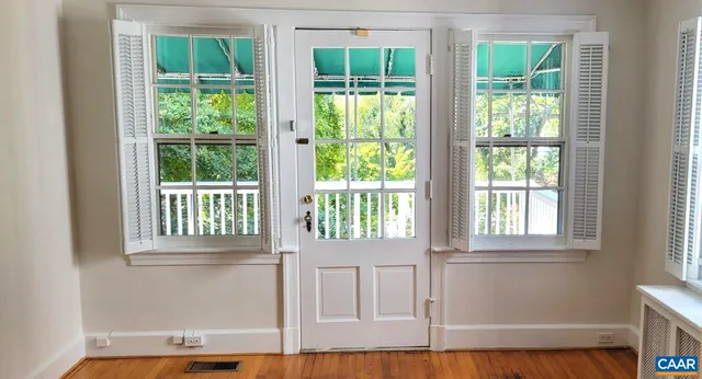 a view of an entryway with wooden floor