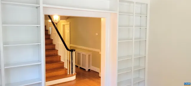 a view of entryway with wooden floor