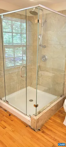 a bathroom with a bathtub and a shower