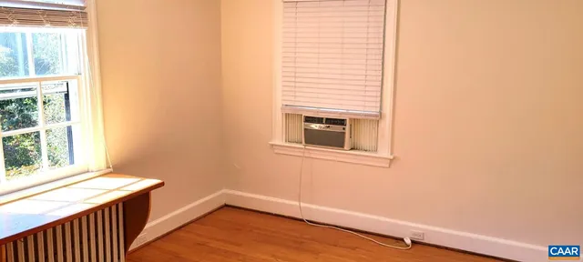 a view of a room that has a window in it