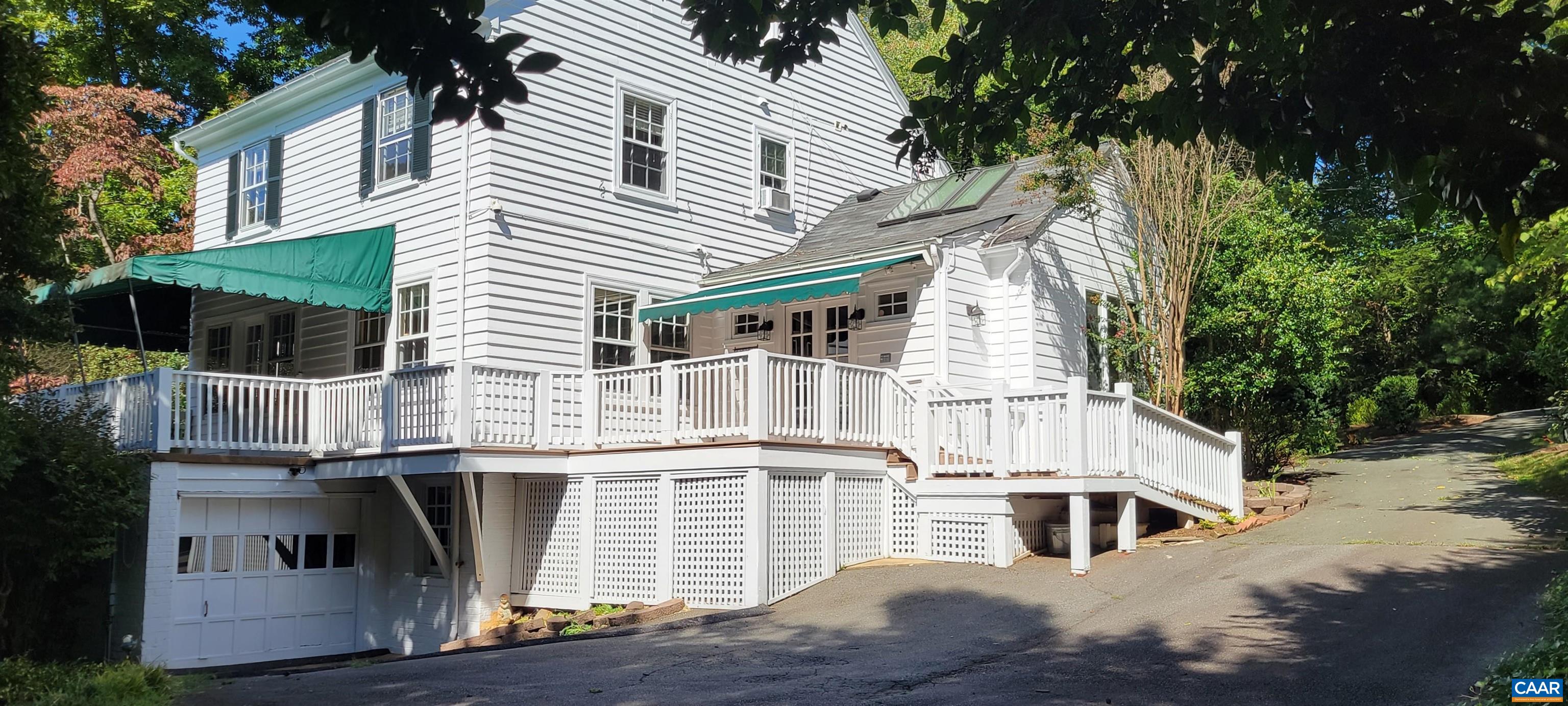 1912 Blue Ridge Road Charlottesville, VA 22903 - Photo 5 of 49 a view of a white house with large windows