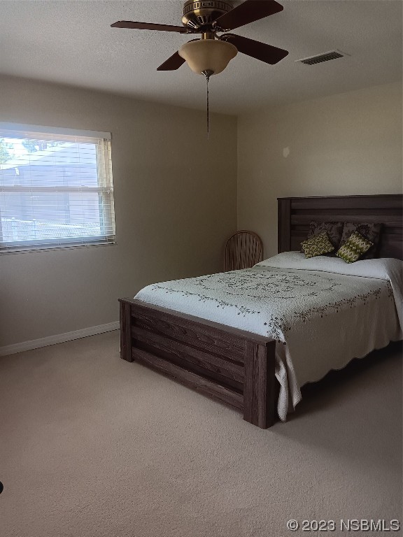 4141 Sterling Street Mims, FL 32754 - Photo 14 of 20 a bedroom with a bed and window