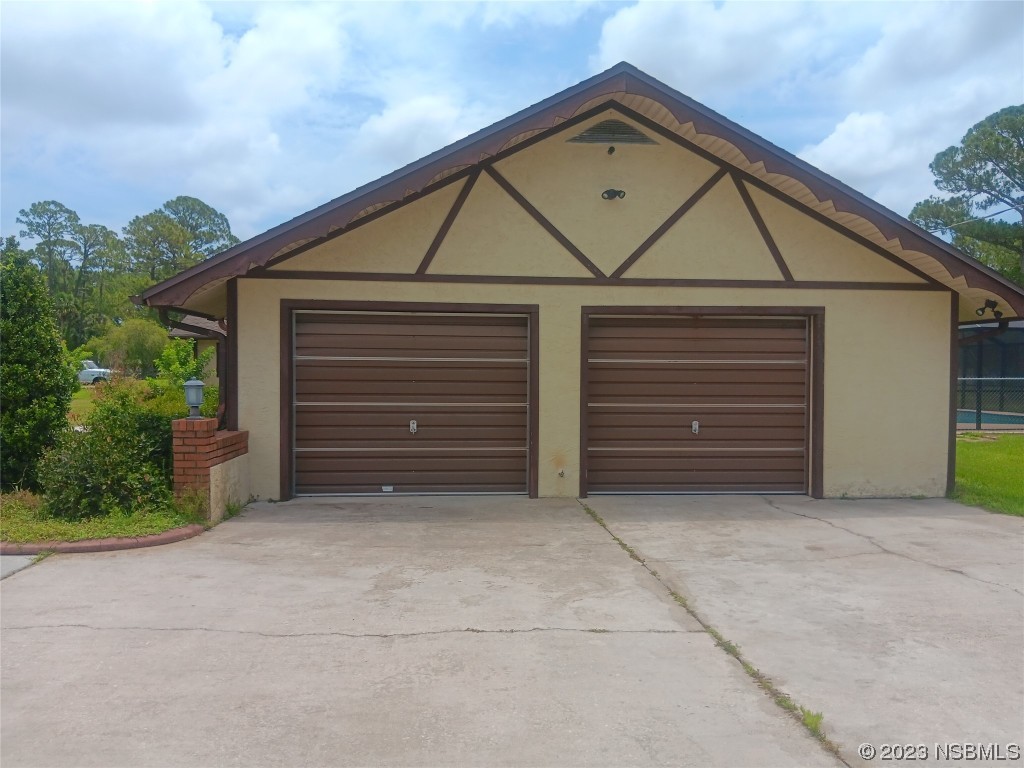 4141 Sterling Street Mims, FL 32754 - Photo 19 of 20 a view of garage with a small barn