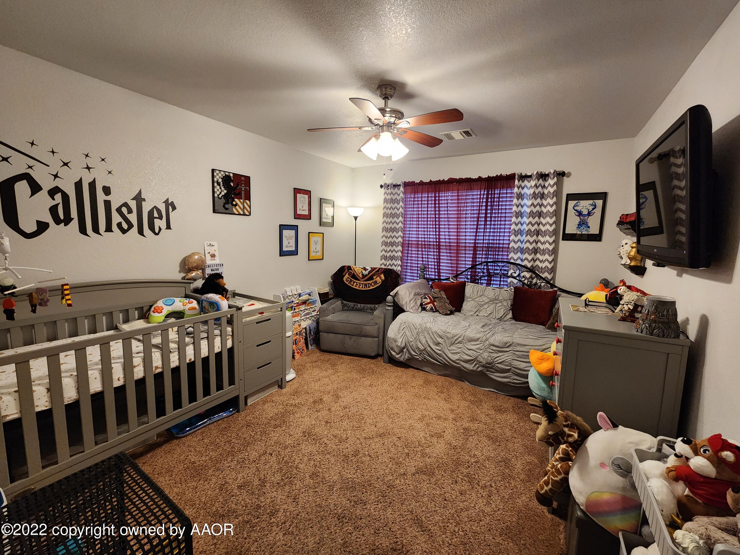 3912 Arden Road Amarillo, TX 79118 - Photo 25 of 35 a bedroom with furniture and a window