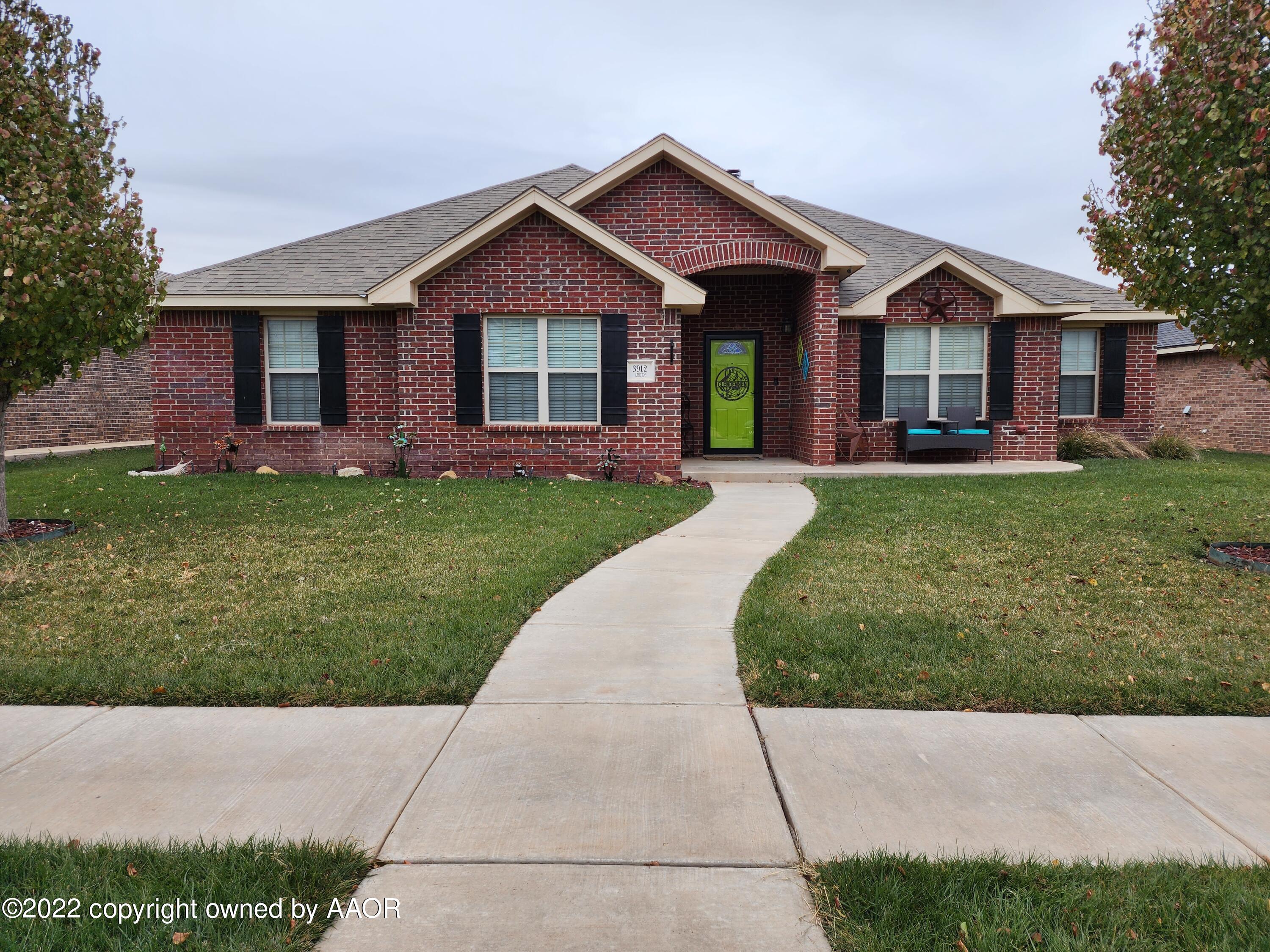 3912 Arden Road Amarillo, TX 79118 - Photo 3 of 35 a front view of a house with a garden