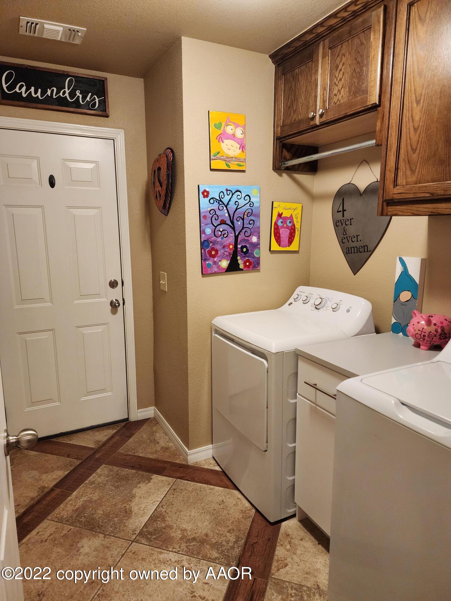 3912 Arden Road Amarillo, TX 79118 - Photo 31 of 35 a utility room with dryer and washer