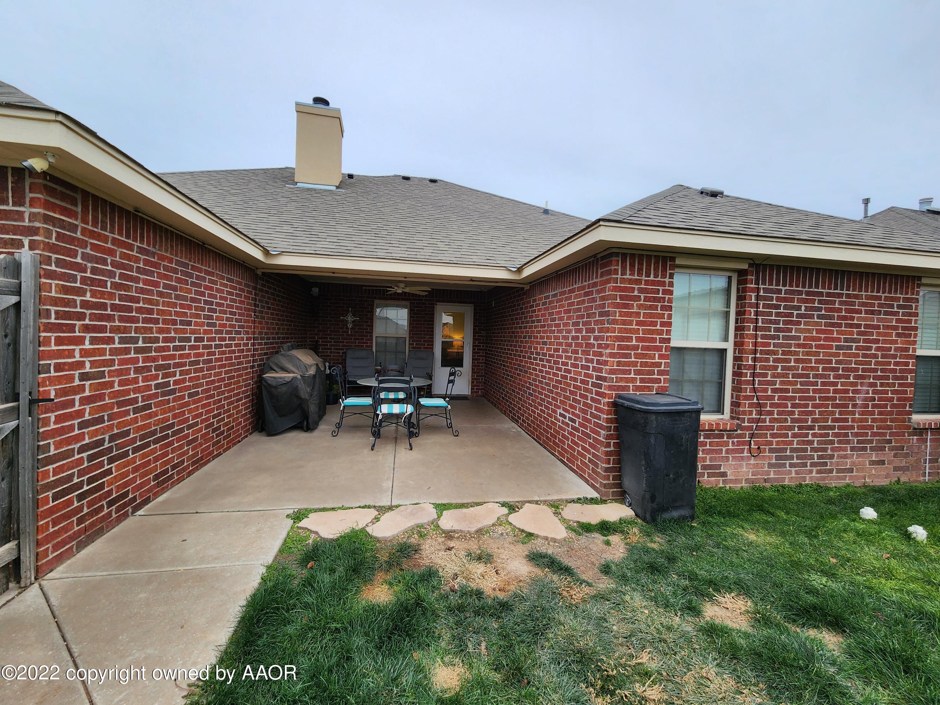 3912 Arden Road Amarillo, TX 79118 - Photo 33 of 35 a front view of a house with garden