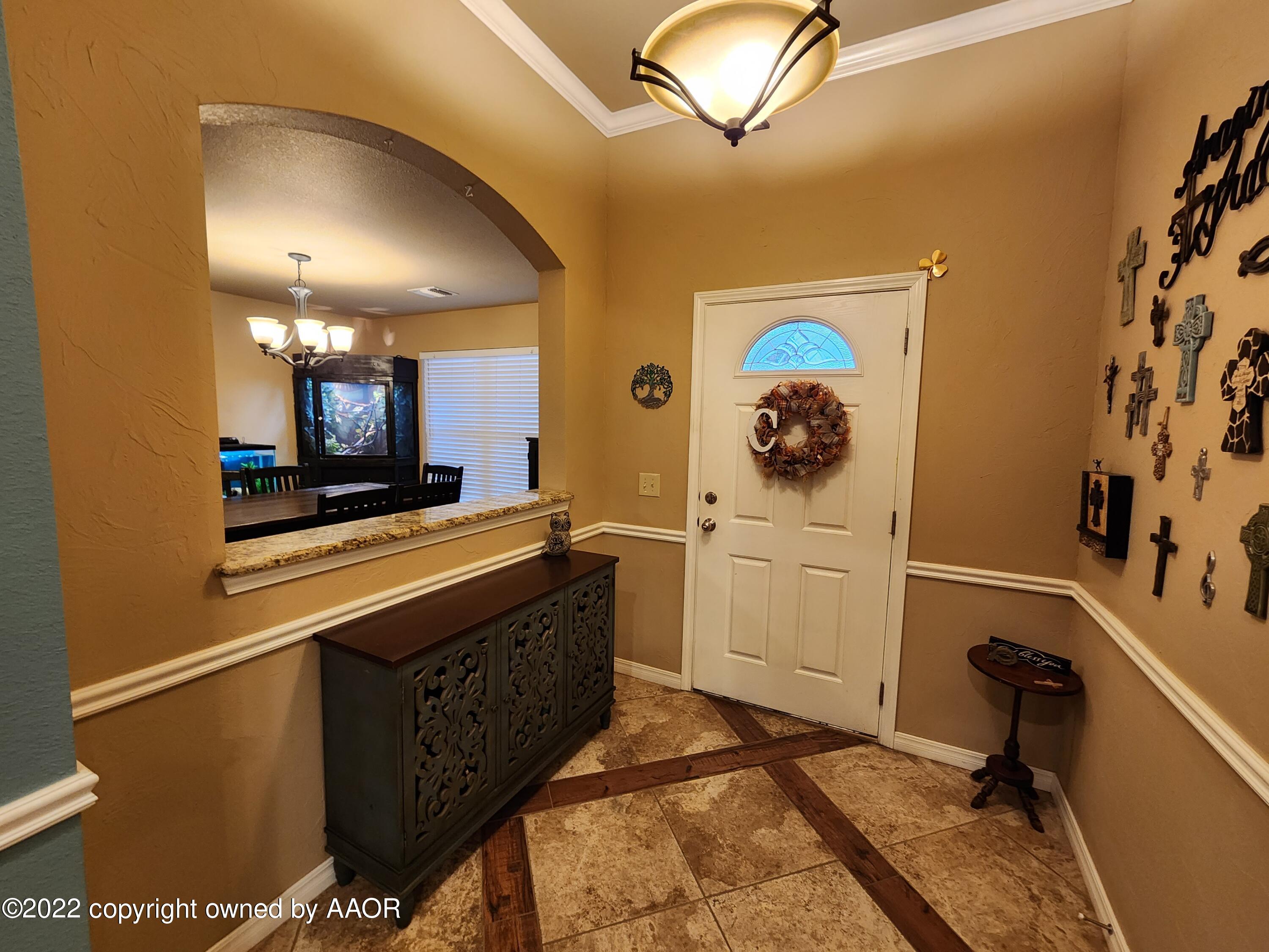 3912 Arden Road Amarillo, TX 79118 - Photo 4 of 35 a kitchen with a sink cabinets and appliances