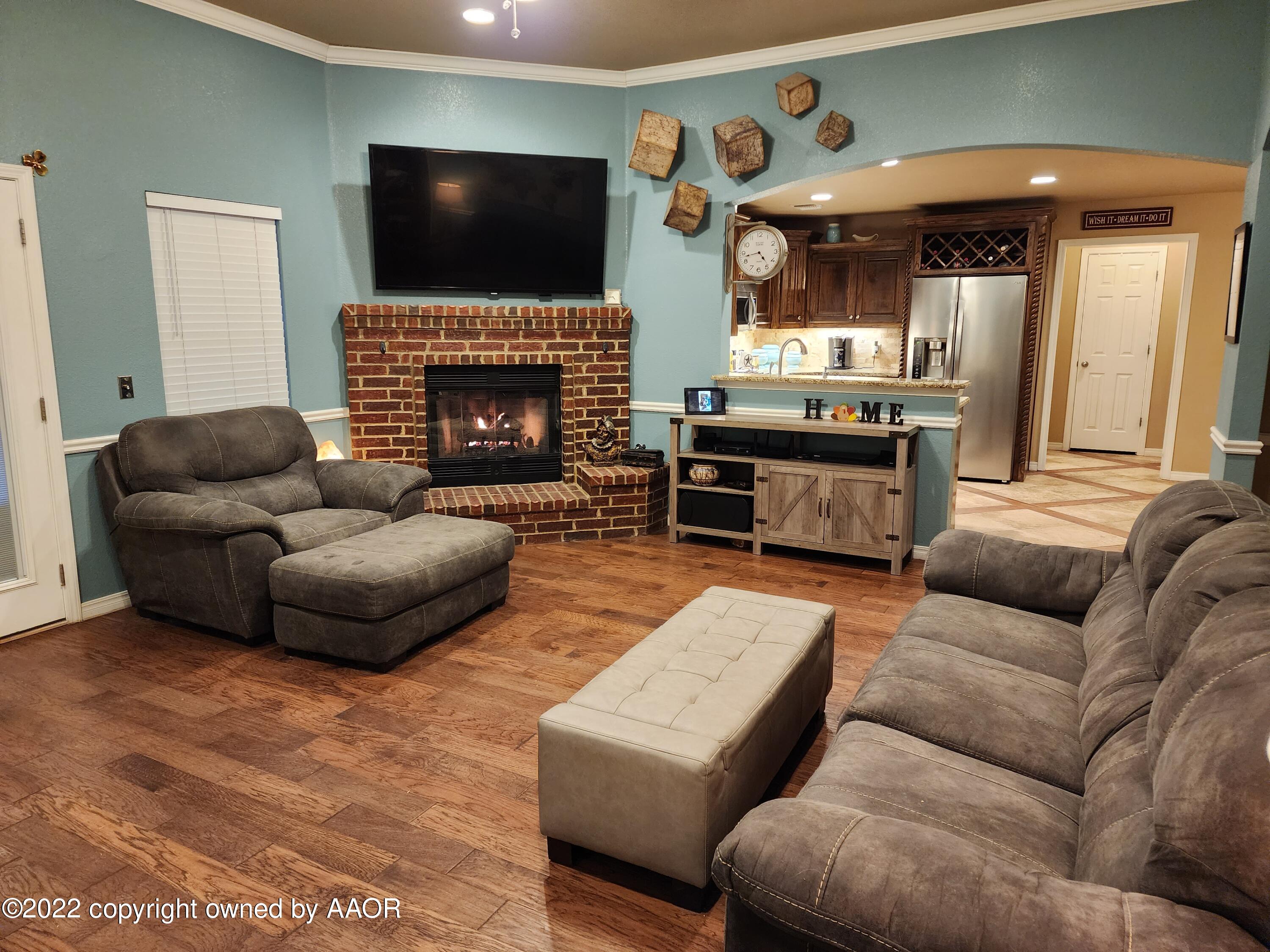 3912 Arden Road Amarillo, TX 79118 - Photo 10 of 35 a living room with furniture and a fireplace