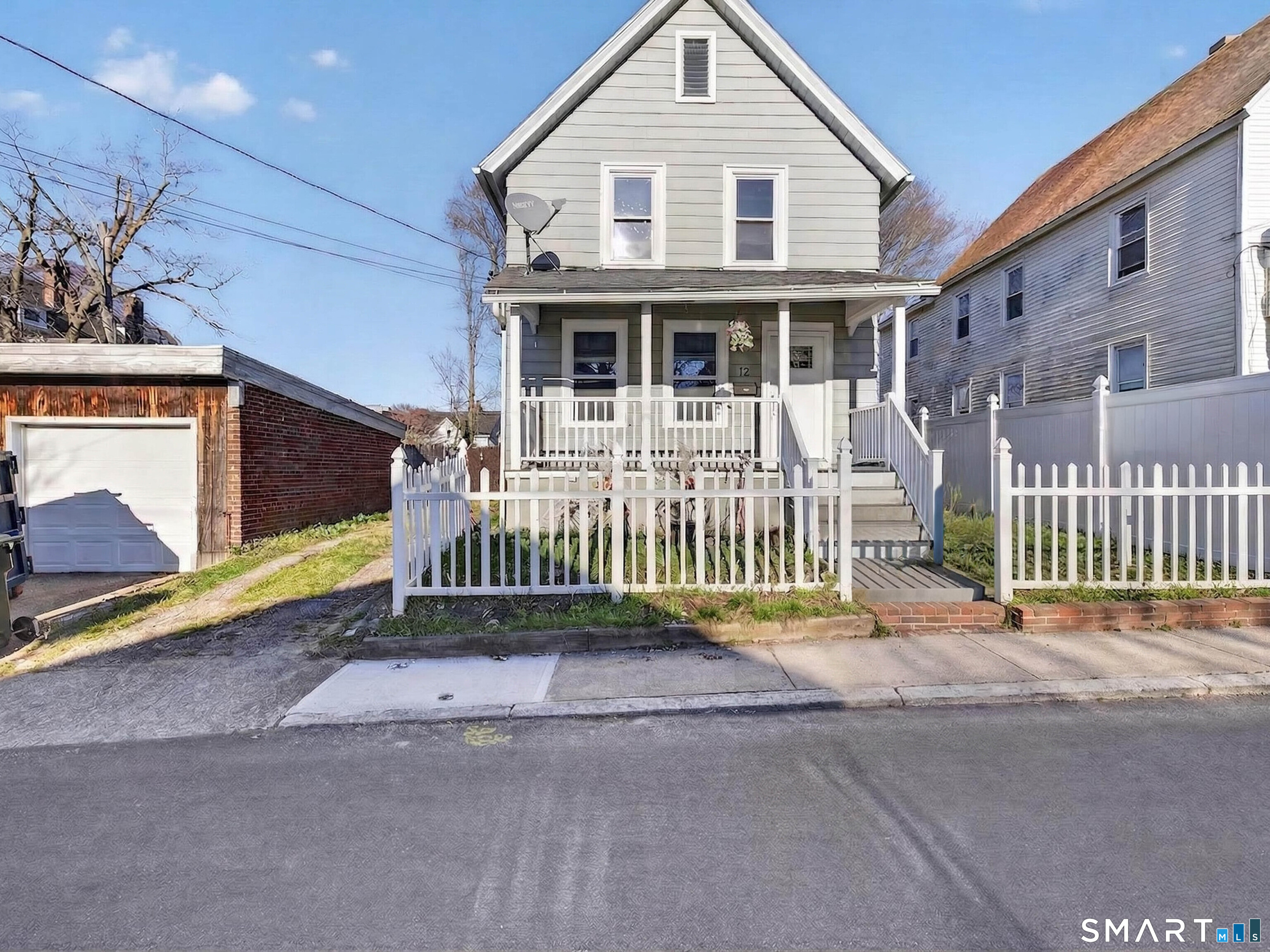 front view of a house with a small yard
