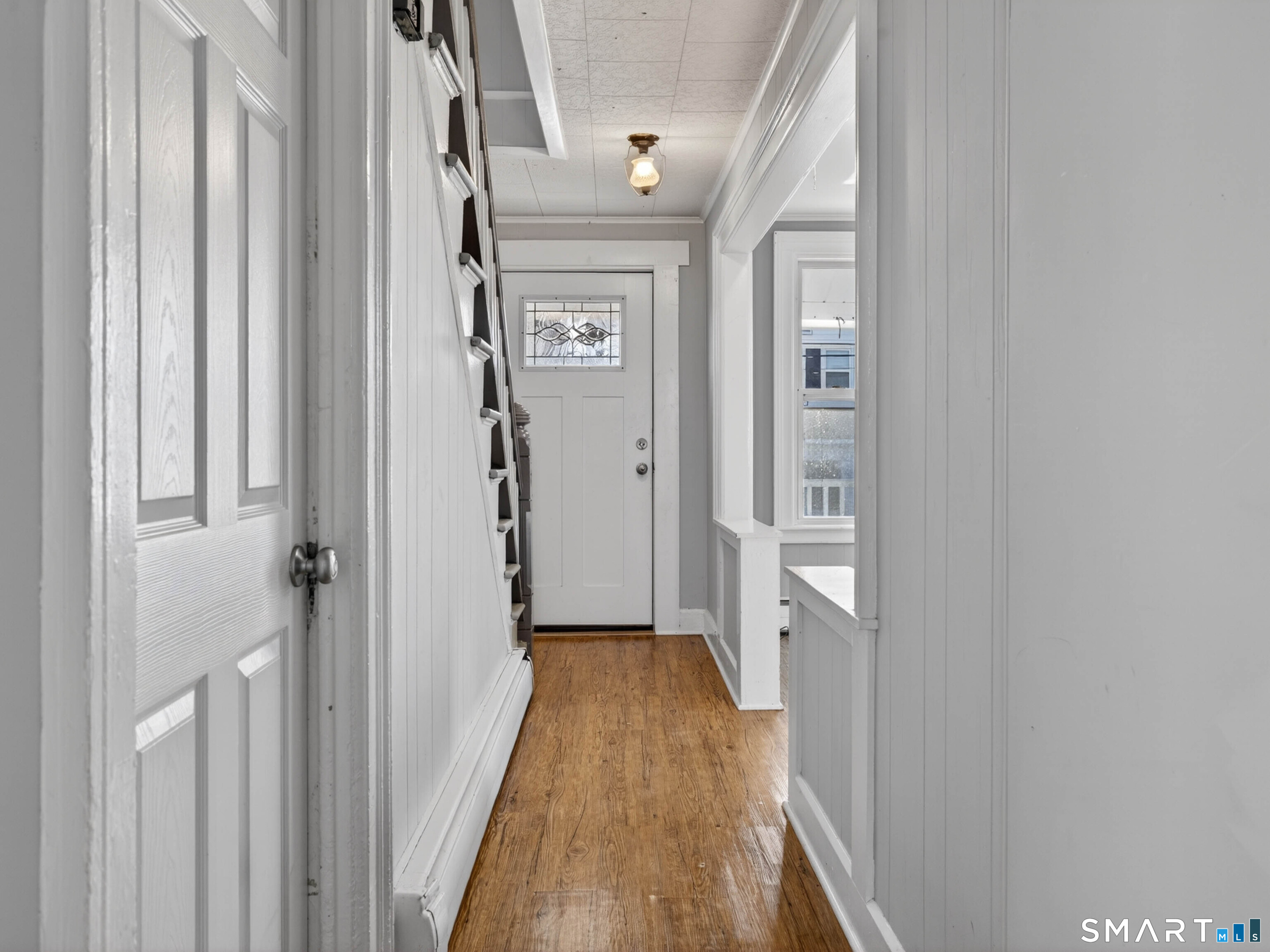 12 Clover Court New London, CT 06320 - Photo 13 of 29 a view of a hallway with wooden floor and staircase