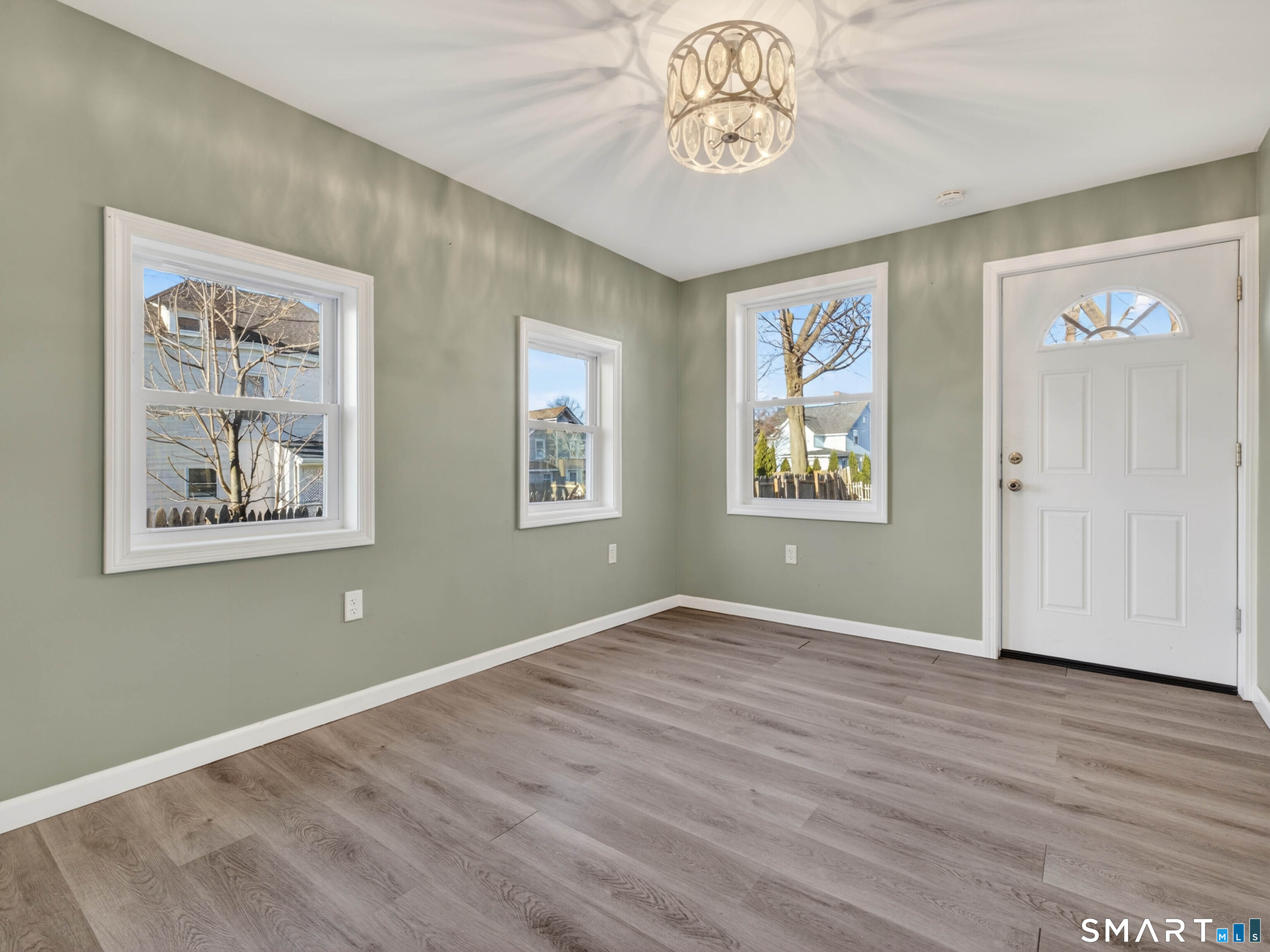 12 Clover Court New London, CT 06320 - Photo 18 of 29 a view of an empty room with wooden floor and a window