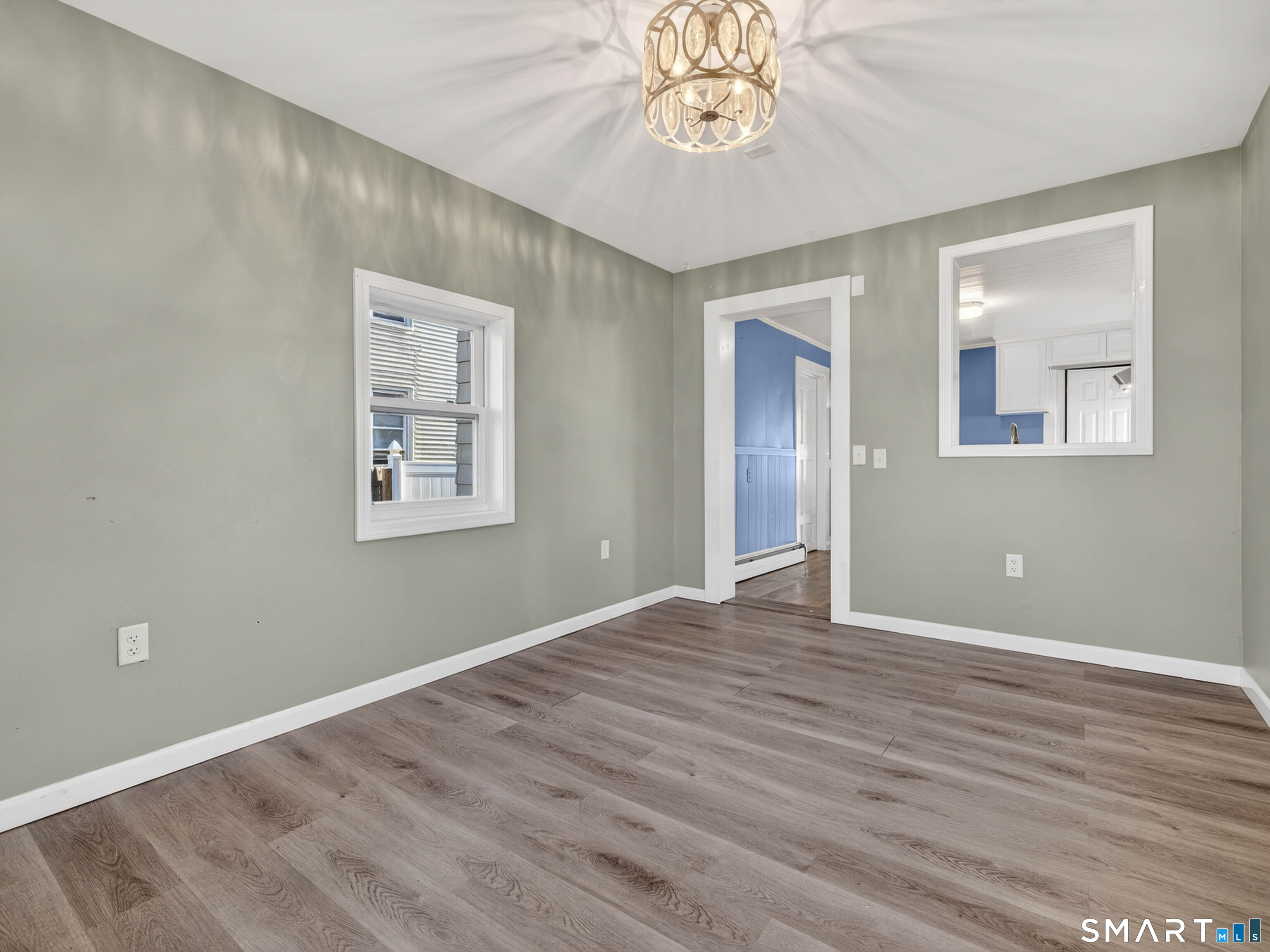 12 Clover Court New London, CT 06320 - Photo 19 of 29 a view of an empty room with wooden floor