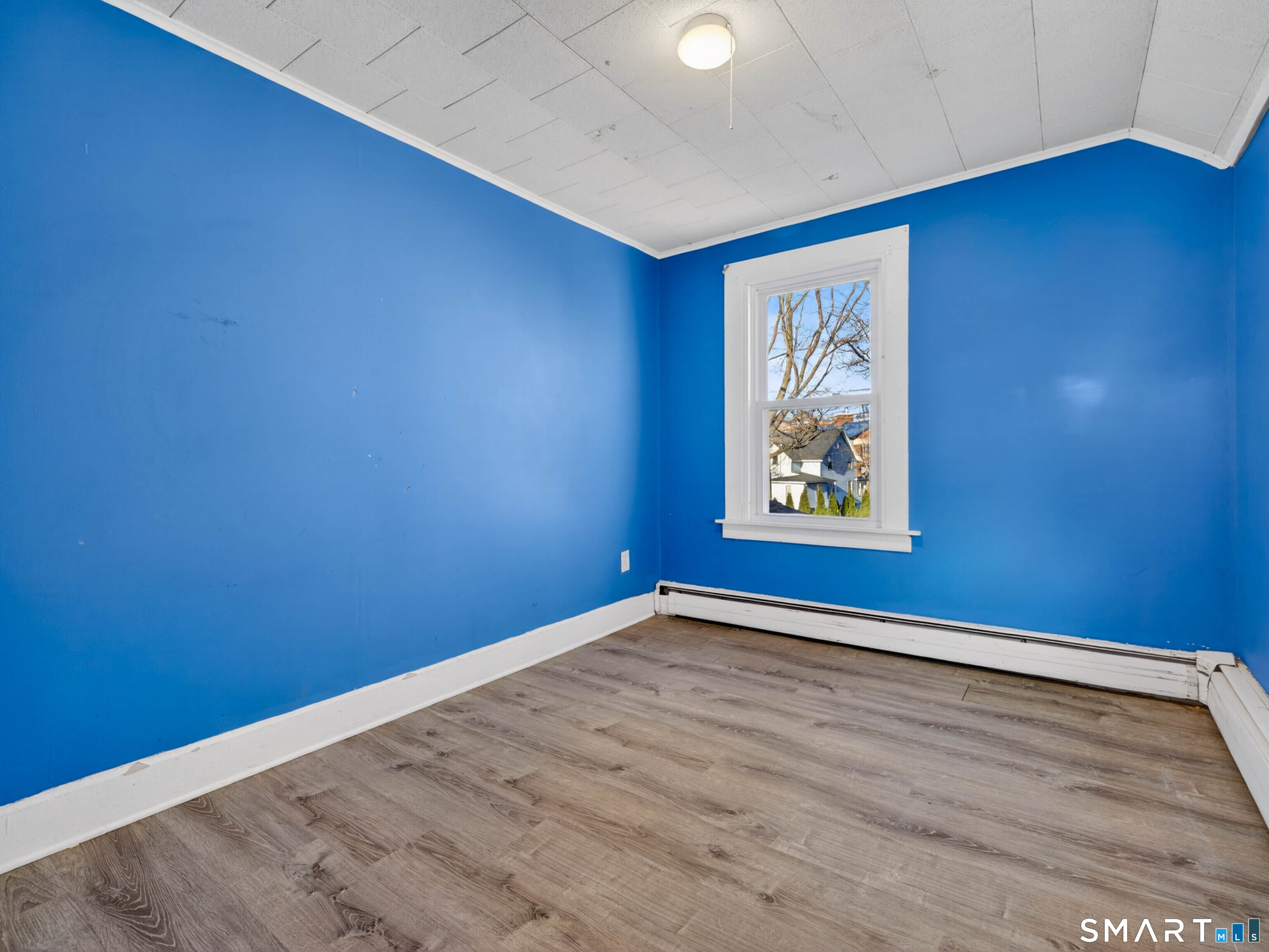 12 Clover Court New London, CT 06320 - Photo 20 of 29 an empty room with wooden floor and windows