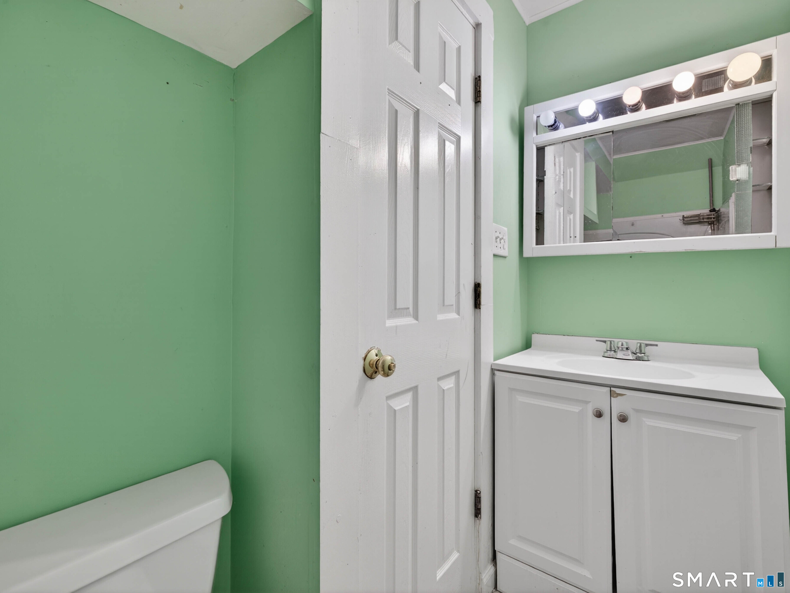 12 Clover Court New London, CT 06320 - Photo 23 of 29 a bathroom with a sink a toilet and mirror