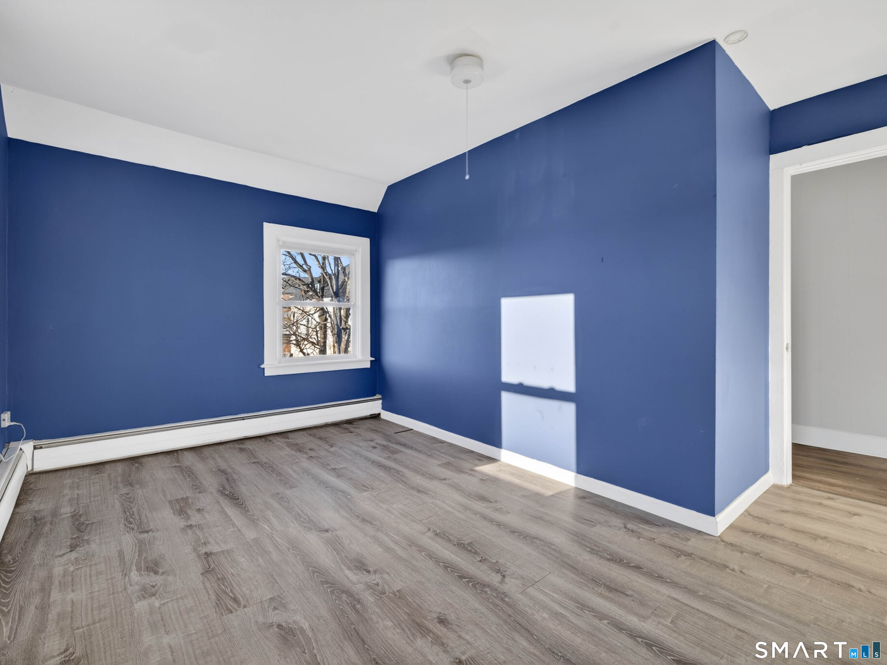 12 Clover Court New London, CT 06320 - Photo 27 of 29 an empty room with wooden floor and windows