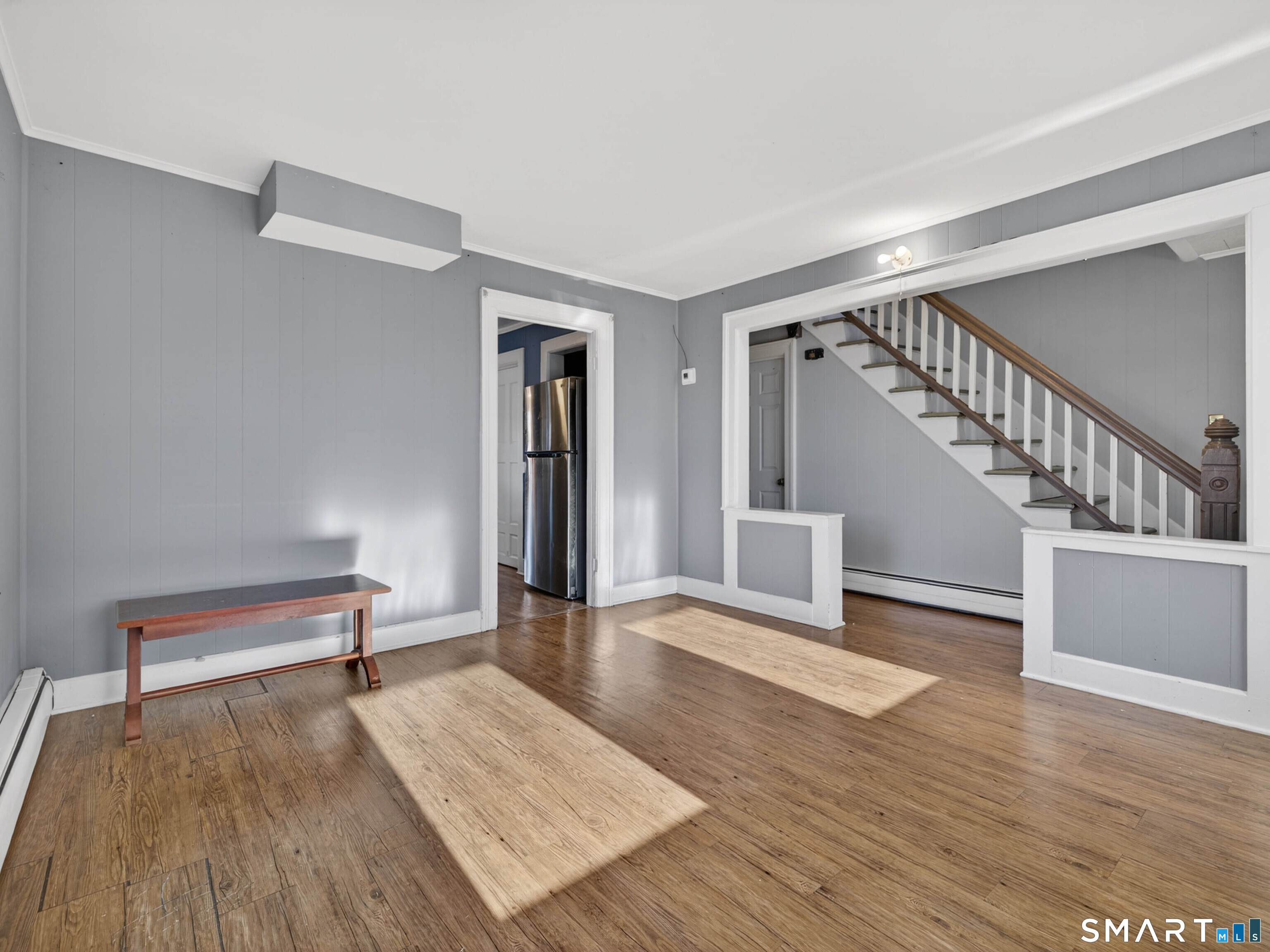 12 Clover Court New London, CT 06320 - Photo 9 of 29 a view of a livingroom with wooden floor and stairs