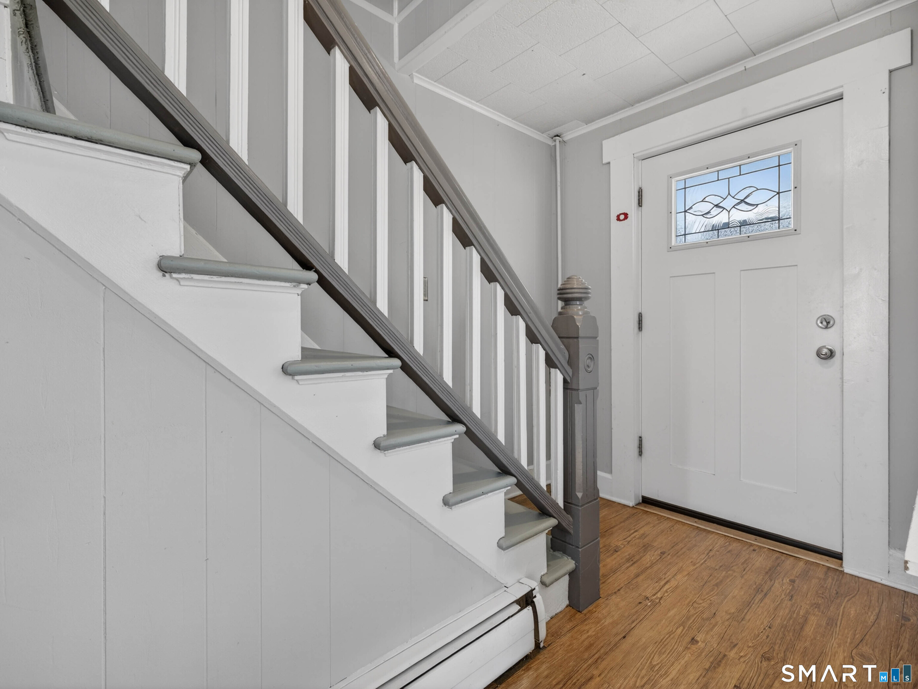 12 Clover Court New London, CT 06320 - Photo 10 of 29 a view of staircase with wooden floor and white walls