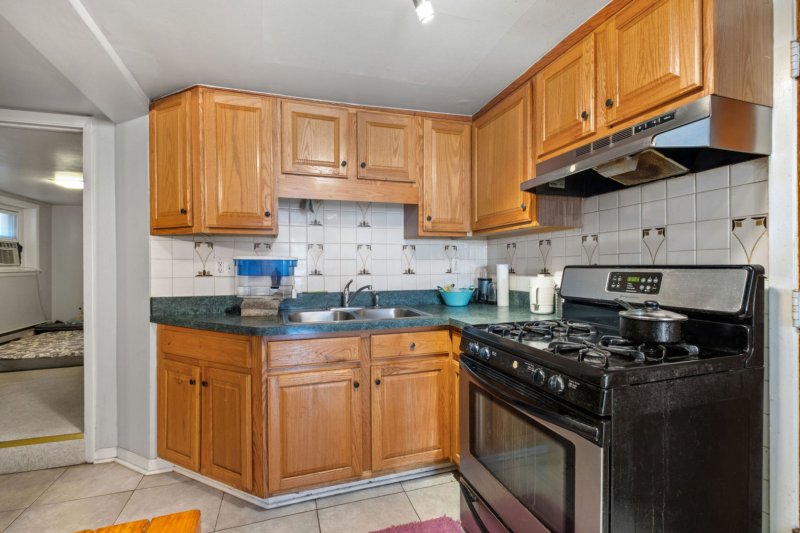 1934 West Race Avenue Chicago, IL 60622 - Photo 19 of 35 a kitchen with stainless steel appliances granite countertop a stove a sink and a refrigerator