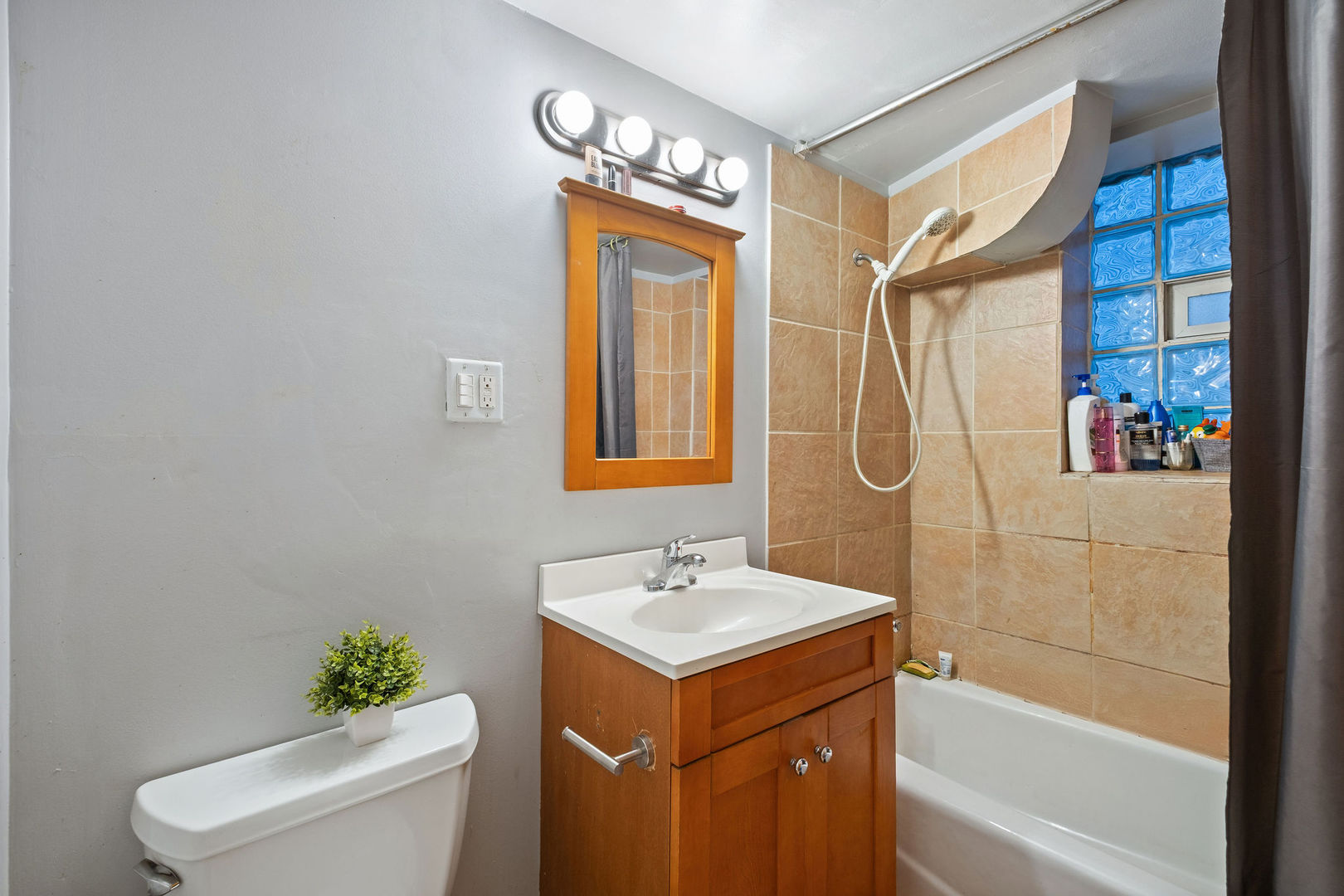 1934 West Race Avenue Chicago, IL 60622 - Photo 26 of 35 a bathroom with a sink a toilet and shower