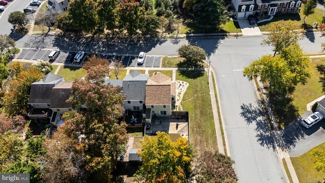 an aerial view of a house with a yard and garden