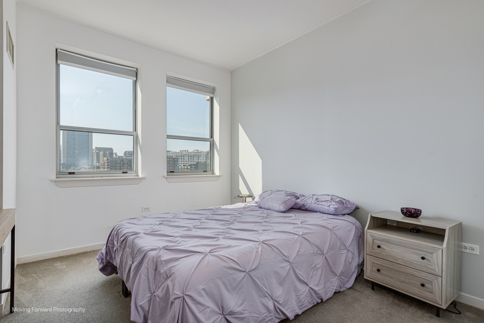 511 West Division Street, Unit 609 Chicago, IL 60610 - Photo 14 of 21 a bedroom with a bed and a window