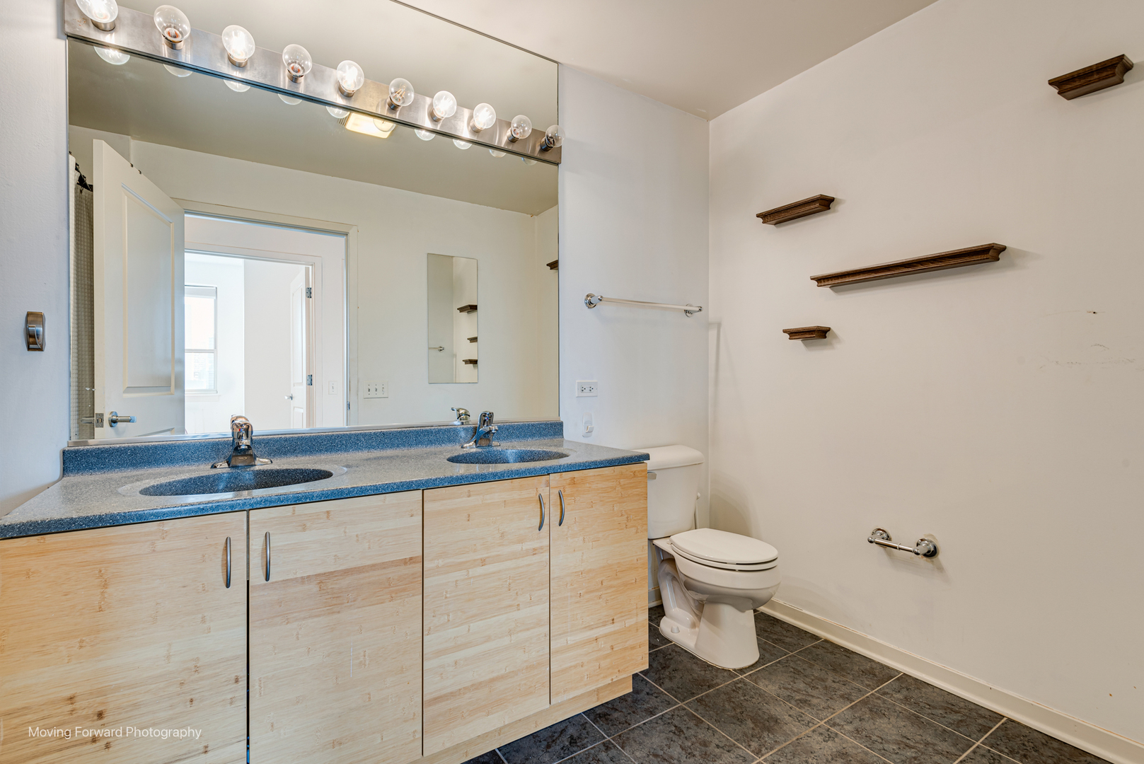 511 West Division Street, Unit 609 Chicago, IL 60610 - Photo 16 of 21 a bathroom with a granite countertop sink a toilet and a mirror