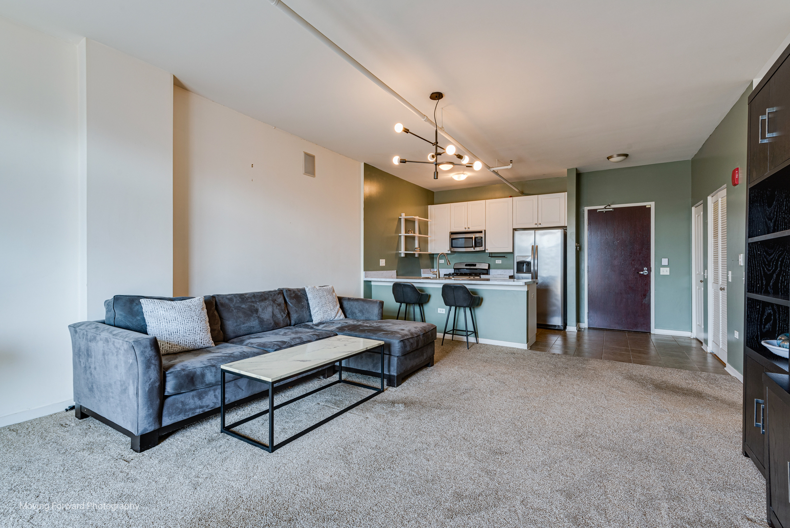 511 West Division Street, Unit 609 Chicago, IL 60610 - Photo 8 of 21 a living room with furniture and kitchen view