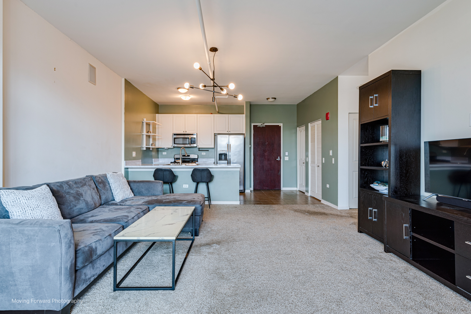 511 West Division Street, Unit 609 Chicago, IL 60610 - Photo 9 of 21 a living room with furniture and kitchen view