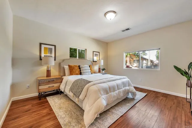 a bed room with a bed and a window