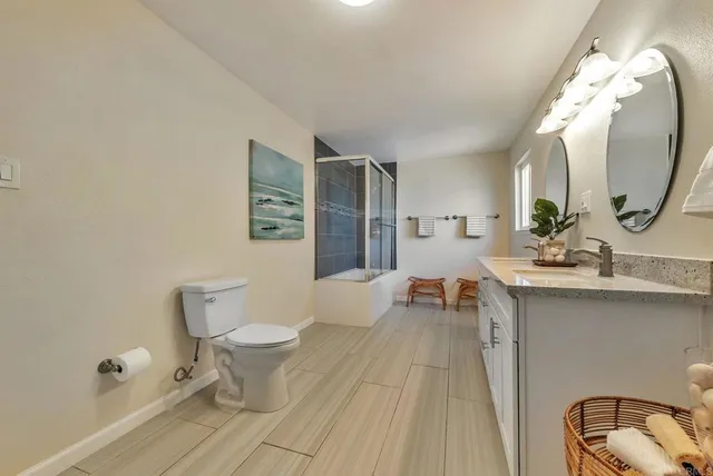 a living room with a toilet and a mirror