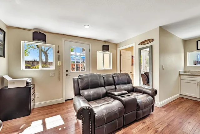 a living room with furniture and a window