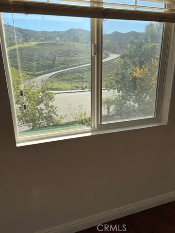 a view of a room that has a bed