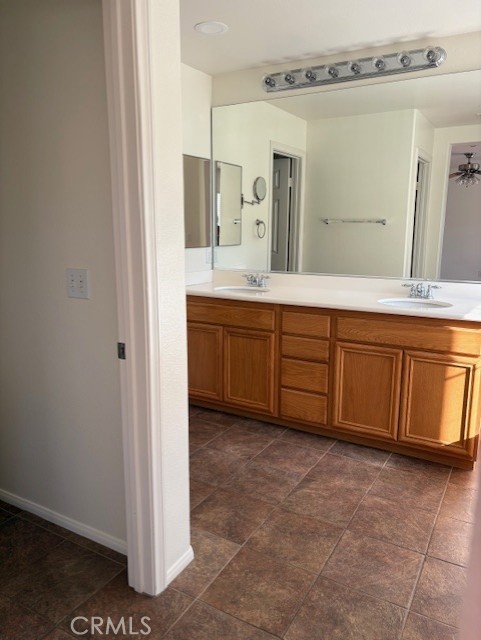 5824 Oak Fern Court Simi Valley, CA 93063 - Photo 14 of 31 a spacious bathroom with a double vanity sink a mirror and a bathtub