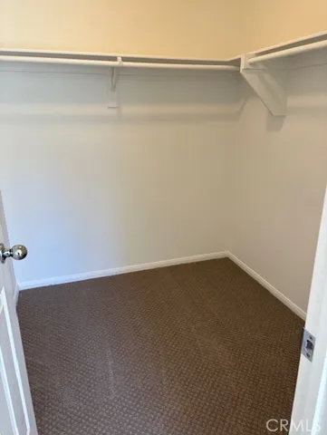 a view of a bedroom from a hallway