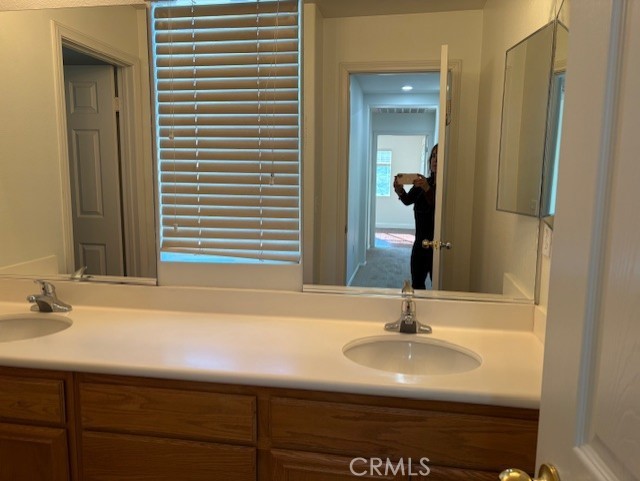 5824 Oak Fern Court Simi Valley, CA 93063 - Photo 20 of 31 a bathroom with a sink and a mirror