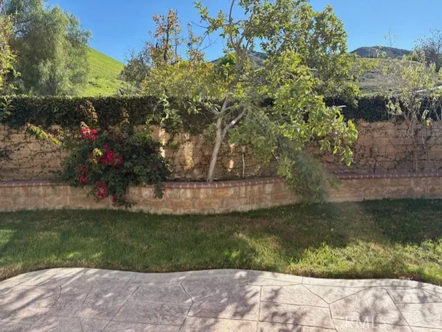 a view of a room with an empty space and a window