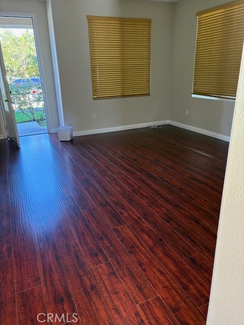 5824 Oak Fern Court Simi Valley, CA 93063 - Photo 6 of 31 an empty room with wooden floor and windows