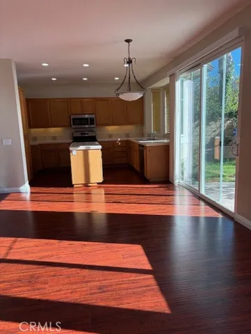 a view of kitchen with wooden floor and staircase
