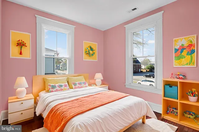 a bedroom with bed and cupboard