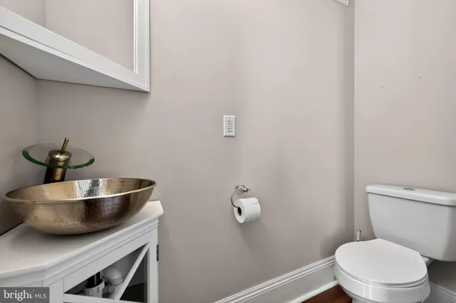 a bathroom with a toilet and a sink